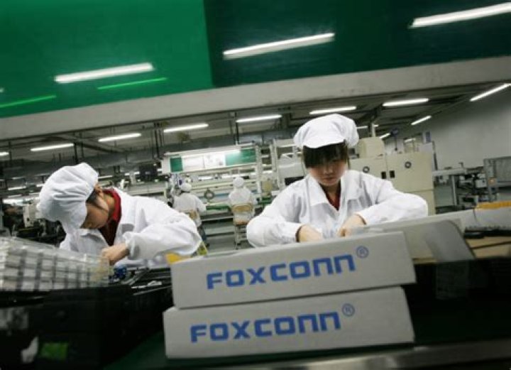 What companies does Foxconn manufacture for?